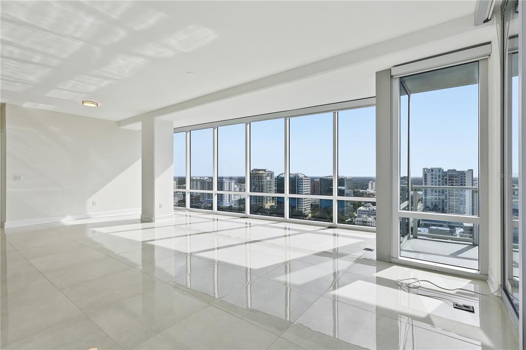 150 East Robinson Street, Unit 2002 Orlando, FL 32801 - Photo 7 of 41 a view of a living room and a large window
