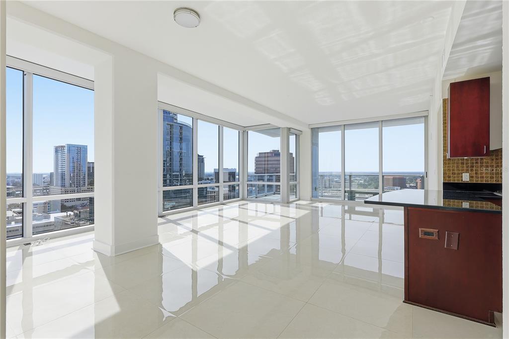 150 East Robinson Street, Unit 2002 Orlando, FL 32801 - Photo 8 of 41 a room with view of kitchen and living room