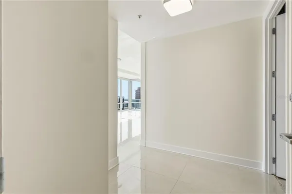 a view of a living room and a large window