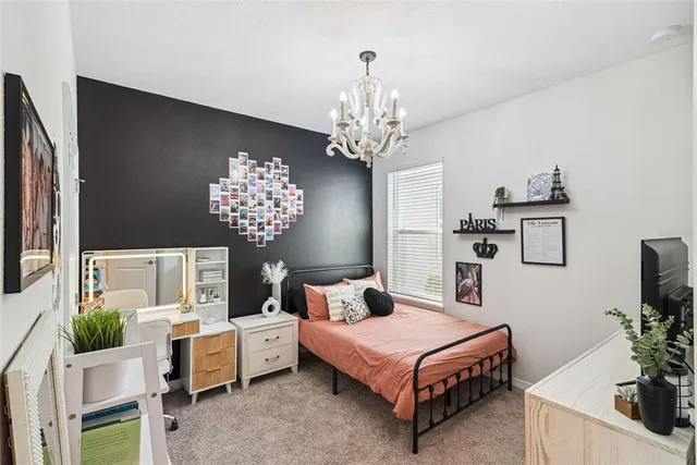 a bathroom with a sink a toilet and shower curtain