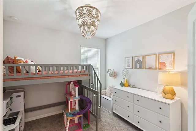 a kitchen with a sink cabinets and wooden floor