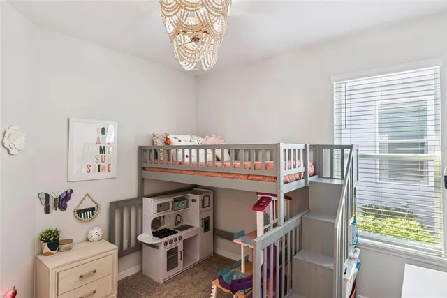 a view of a patio with table and chairs potted plants and a palm tree