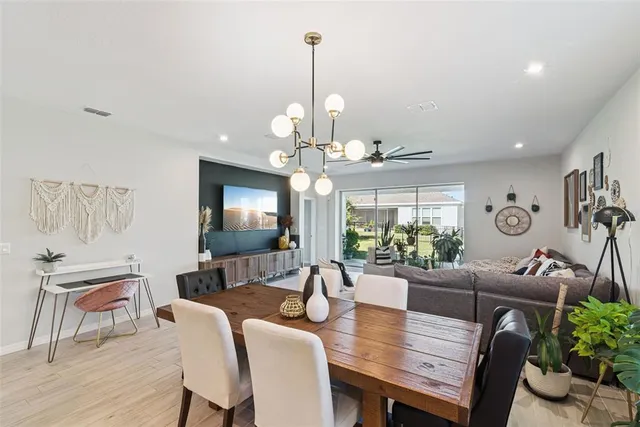 a kitchen with a sink stove and wooden floor