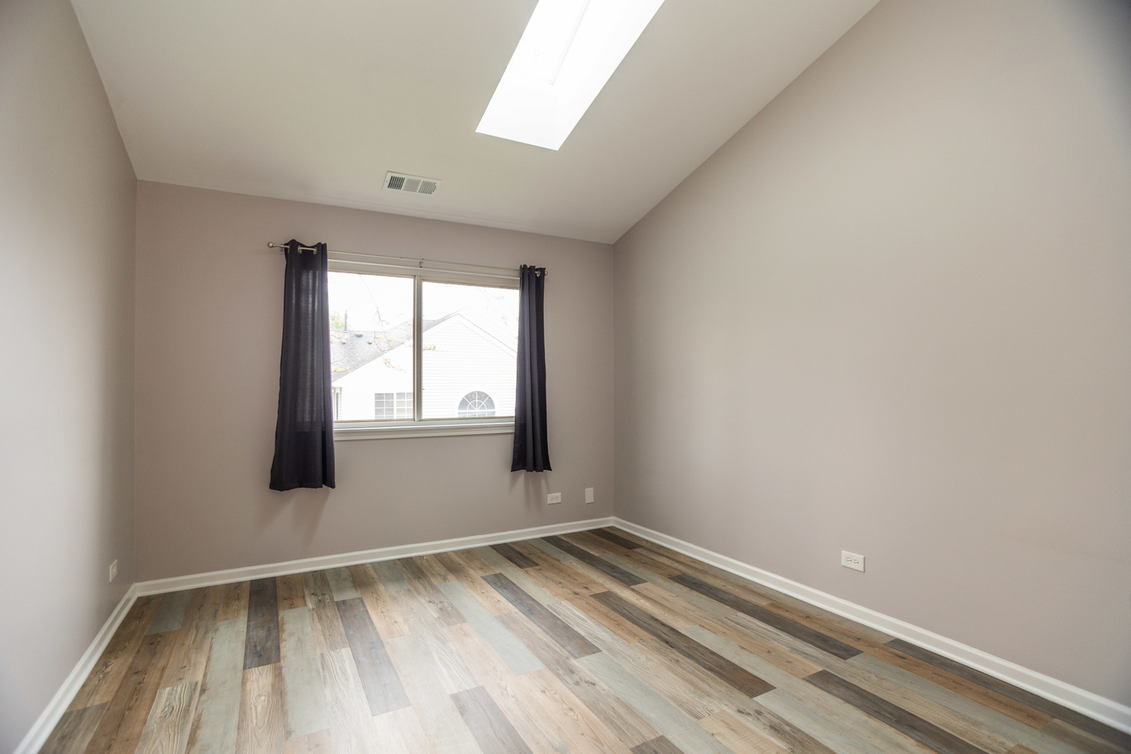 1082 Ripple Ridge Darien, IL 60561 - Photo 17 of 20 a view of empty room with wooden floor and fan