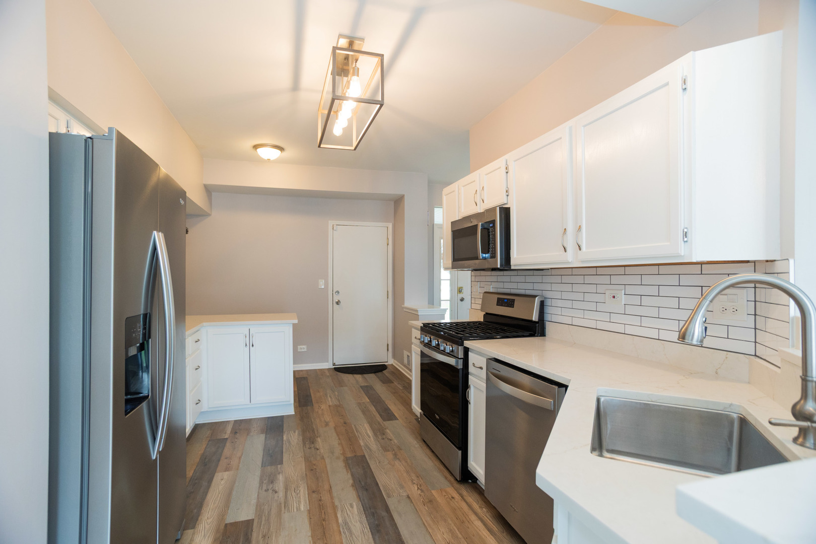 1082 Ripple Ridge Darien, IL 60561 - Photo 8 of 20 a kitchen with a refrigerator sink and stove