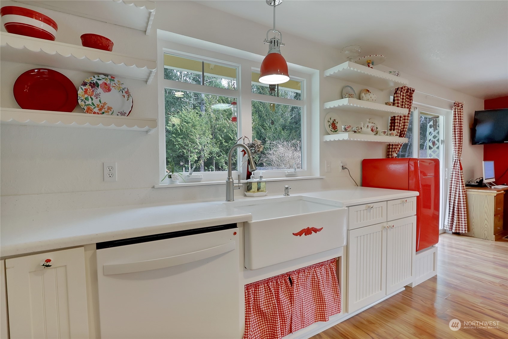 7455 Glacier Ridge Place Southeast Port Orchard, WA 98367 - Photo 11 of 32 a kitchen with a sink a stove and a window
