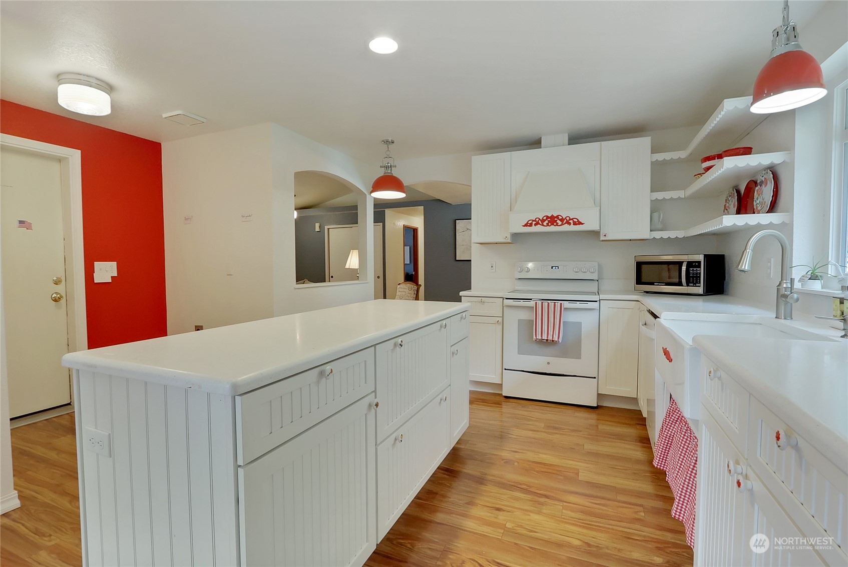 7455 Glacier Ridge Place Southeast Port Orchard, WA 98367 - Photo 12 of 32 a kitchen with cabinets a sink and appliances