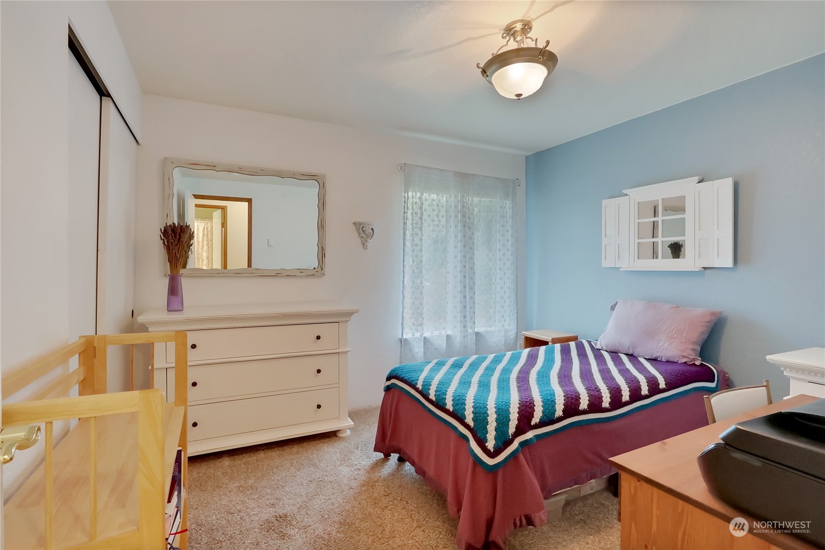 7455 Glacier Ridge Place Southeast Port Orchard, WA 98367 - Photo 17 of 32 a bedroom with a bed and a dresser
