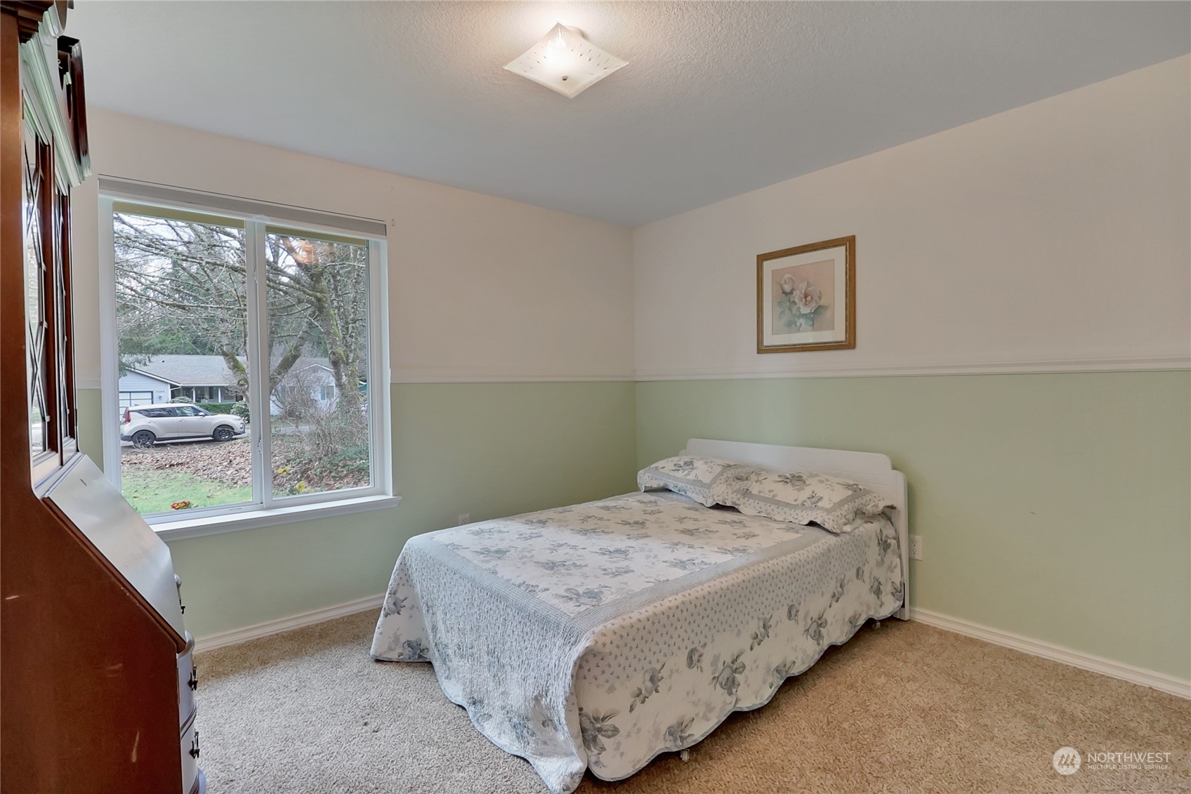 7455 Glacier Ridge Place Southeast Port Orchard, WA 98367 - Photo 18 of 32 a bedroom with a bed and window