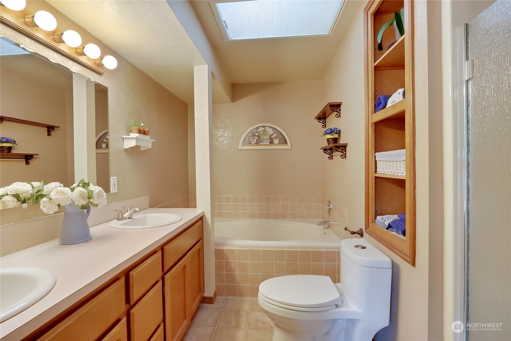 7455 Glacier Ridge Place Southeast Port Orchard, WA 98367 - Photo 23 of 32 a bathroom with a sink a toilet and shower