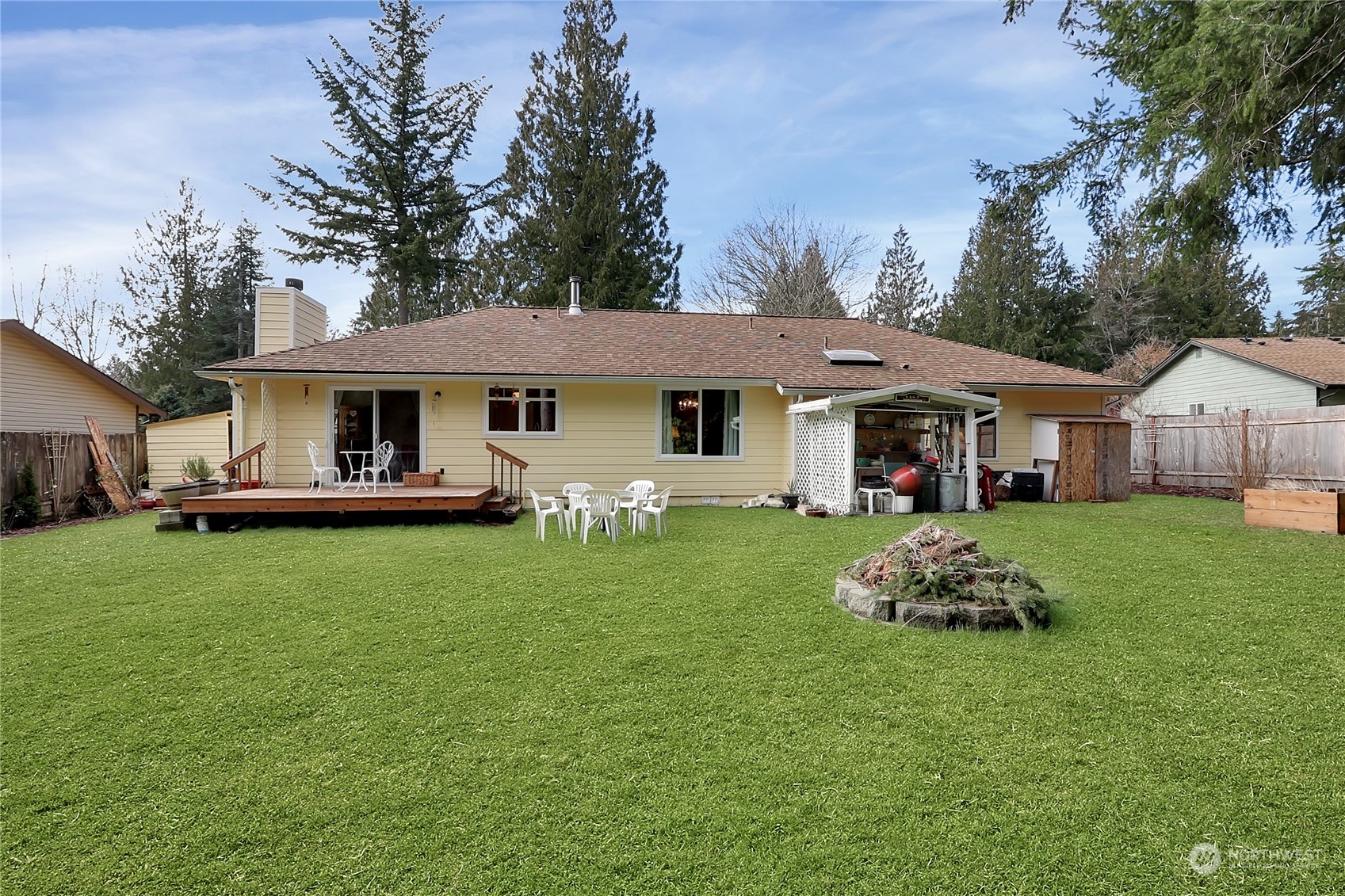7455 Glacier Ridge Place Southeast Port Orchard, WA 98367 - Photo 25 of 32 a front view of a house with a garden