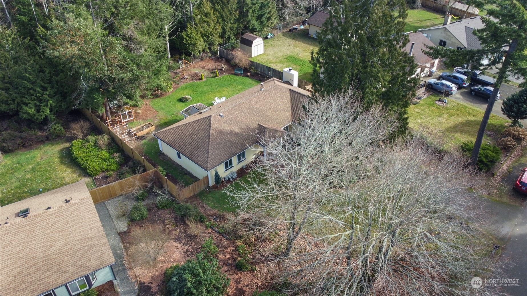 7455 Glacier Ridge Place Southeast Port Orchard, WA 98367 - Photo 28 of 32 an aerial view of a house with a yard and a large tree