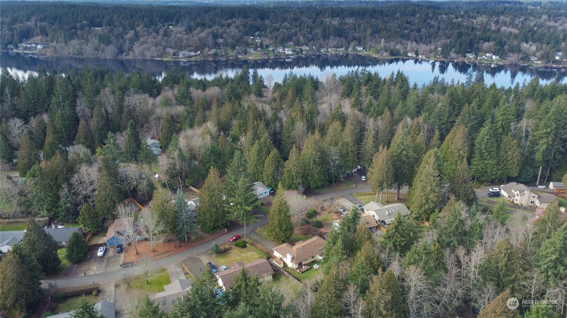 7455 Glacier Ridge Place Southeast Port Orchard, WA 98367 - Photo 31 of 32 a view of a lake with lots of trees