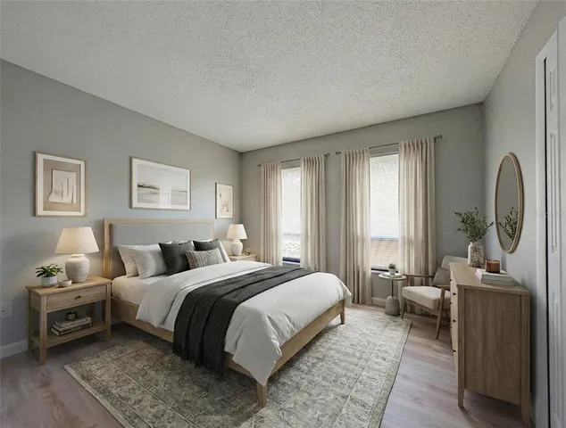 a bedroom with a bed and a couch