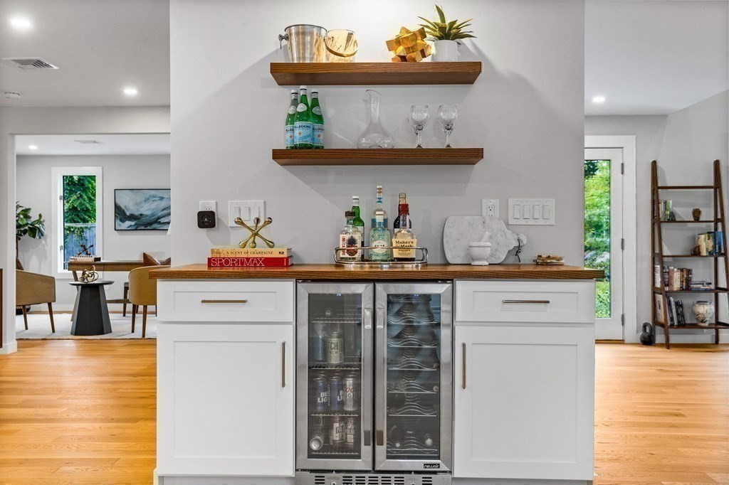142 Ward Street Hingham, MA 02043 - Photo 13 of 41 a kitchen with stainless steel appliances wooden cabinets and a wooden floor