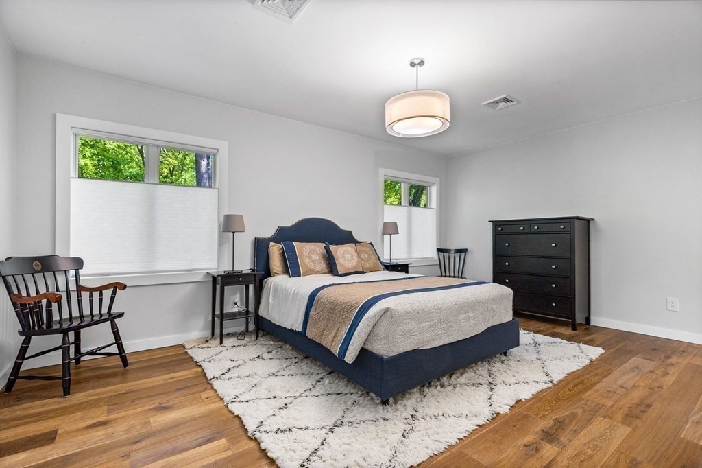 142 Ward Street Hingham, MA 02043 - Photo 27 of 41 a bed room with a bed and a chair