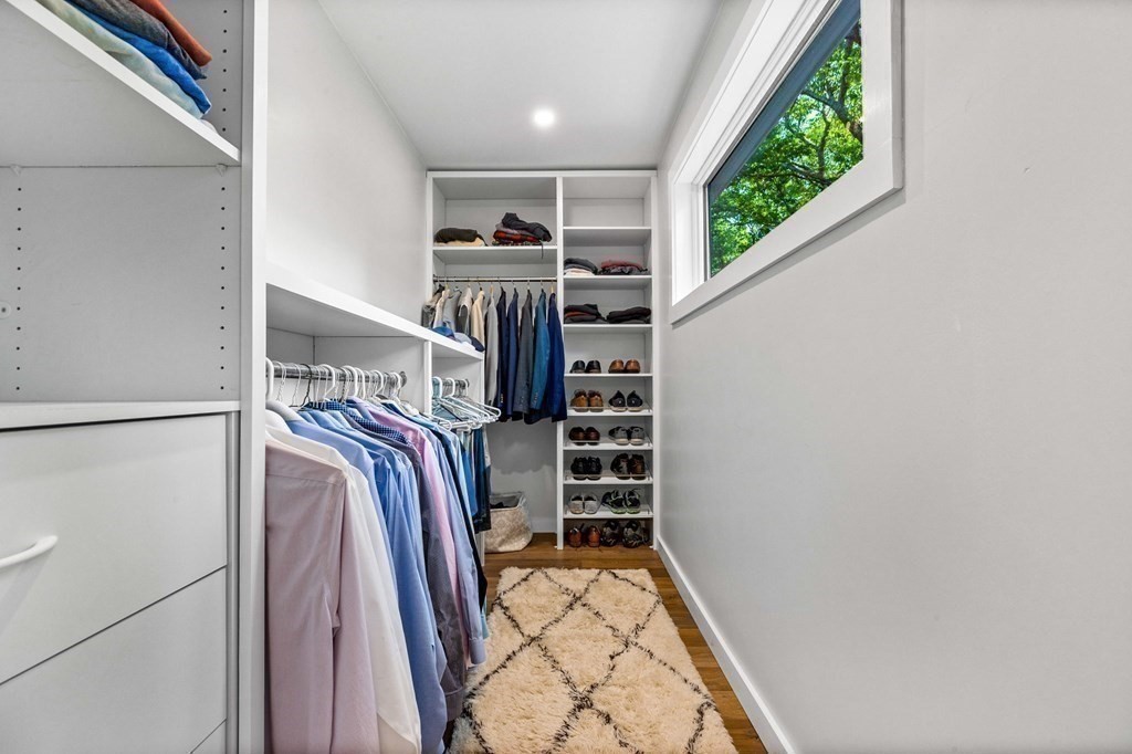 142 Ward Street Hingham, MA 02043 - Photo 28 of 41 a view of walk in closet with clothes and shoes