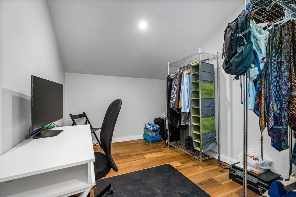 142 Ward Street Hingham, MA 02043 - Photo 29 of 41 a view of a workspace with furniture and a gym