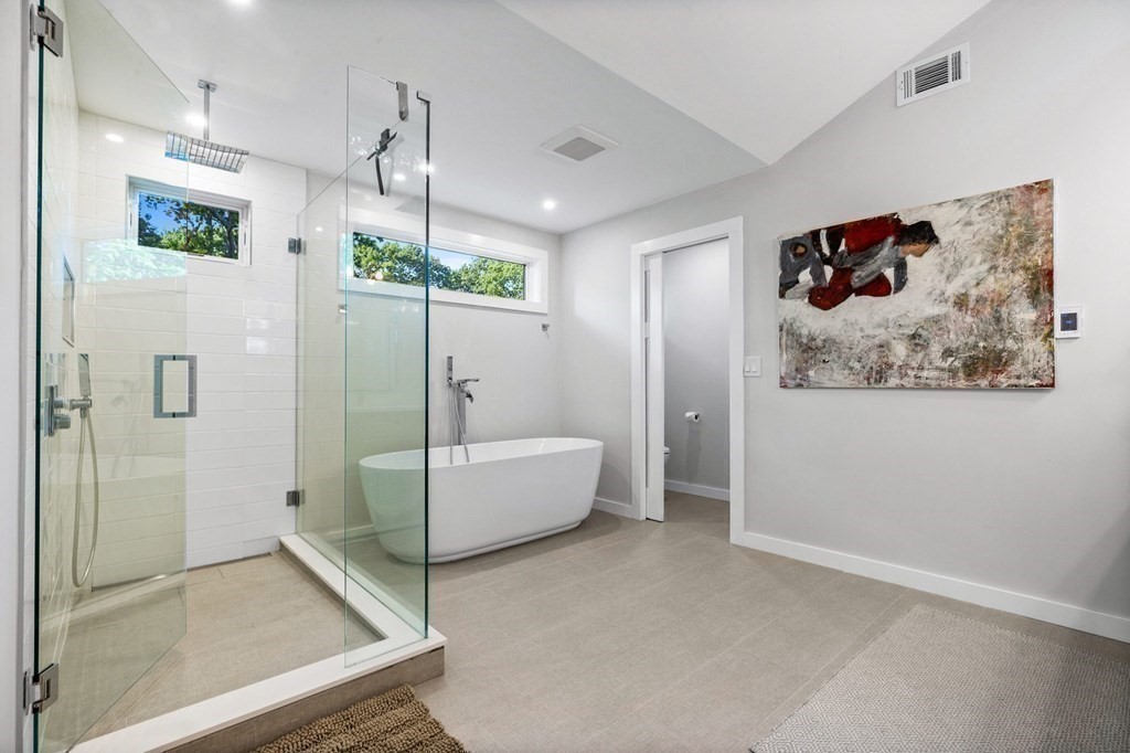 142 Ward Street Hingham, MA 02043 - Photo 30 of 41 a bathroom with a tub shower and window