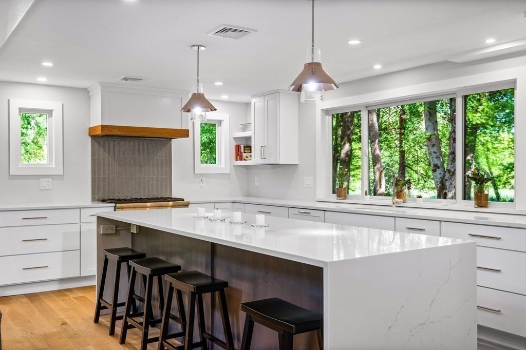 142 Ward Street Hingham, MA 02043 - Photo 3 of 41 a kitchen with a table chairs sink and cabinets