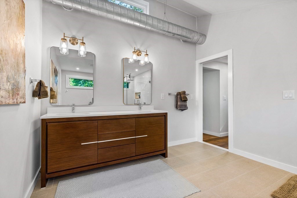 142 Ward Street Hingham, MA 02043 - Photo 31 of 41 a bathroom with a sink a mirror and a vanity