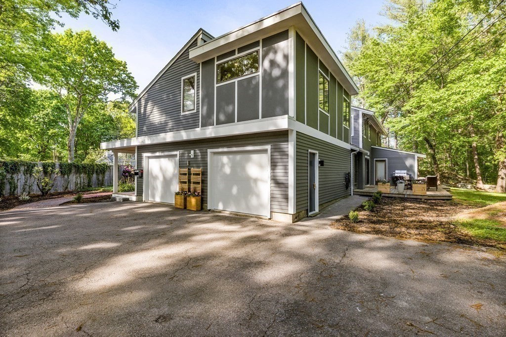 142 Ward Street Hingham, MA 02043 - Photo 33 of 41 a front view of a house with a yard