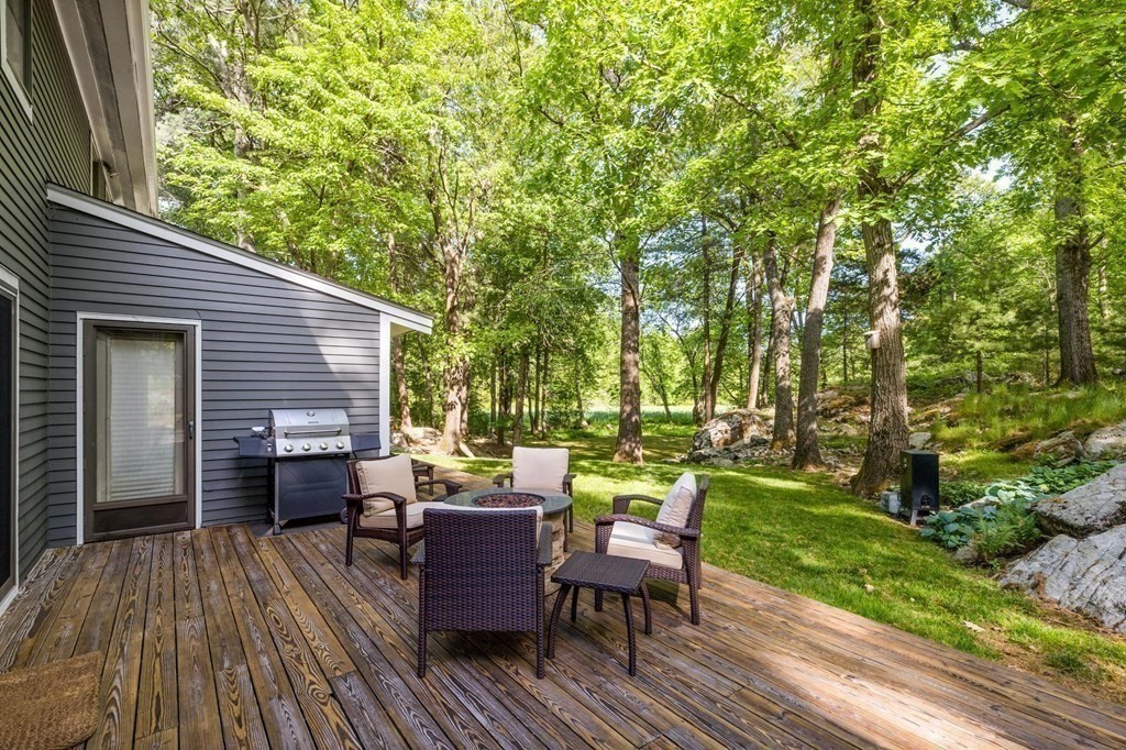 142 Ward Street Hingham, MA 02043 - Photo 38 of 41 a view of a deck with table and chairs and wooden floor