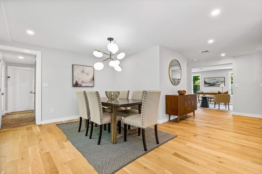 142 Ward Street Hingham, MA 02043 - Photo 10 of 41 a living room with furniture a fireplace and a table