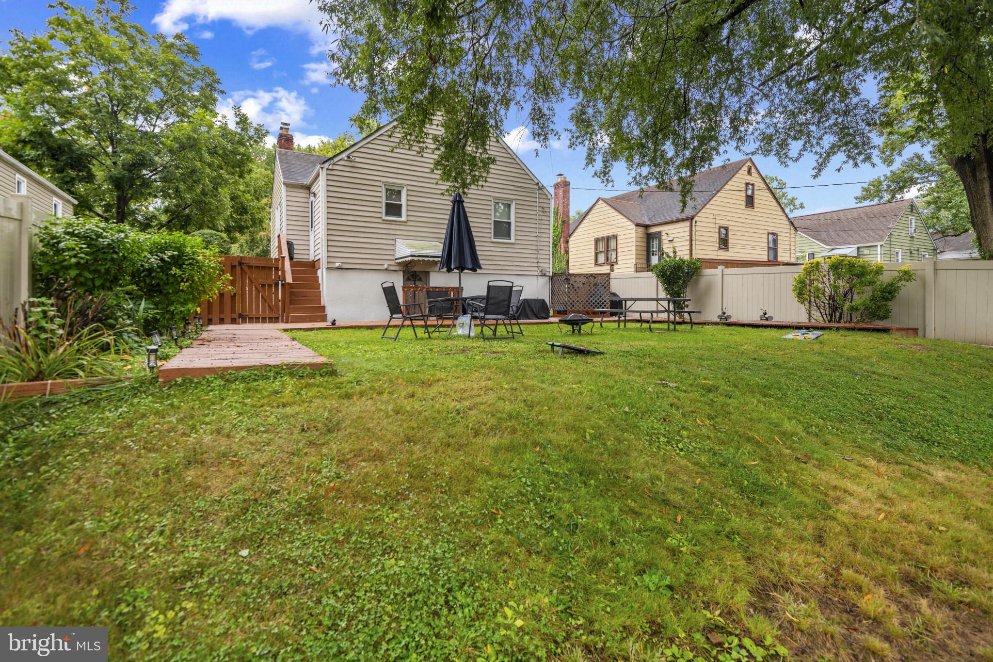 6402 Moyer Avenue Baltimore, MD 21206 - Photo 33 of 35 a front view of a house with yard and green space