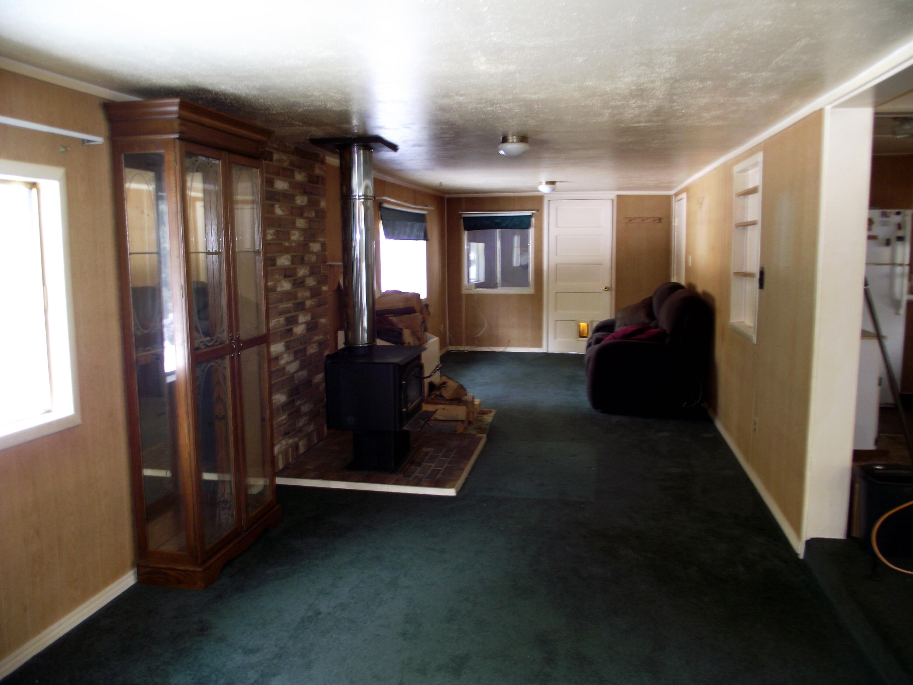 51304 Mitchell Road La Pine, OR 97739 - Photo 14 of 24 Large Family Room with Woodstove- View from front door mudroom