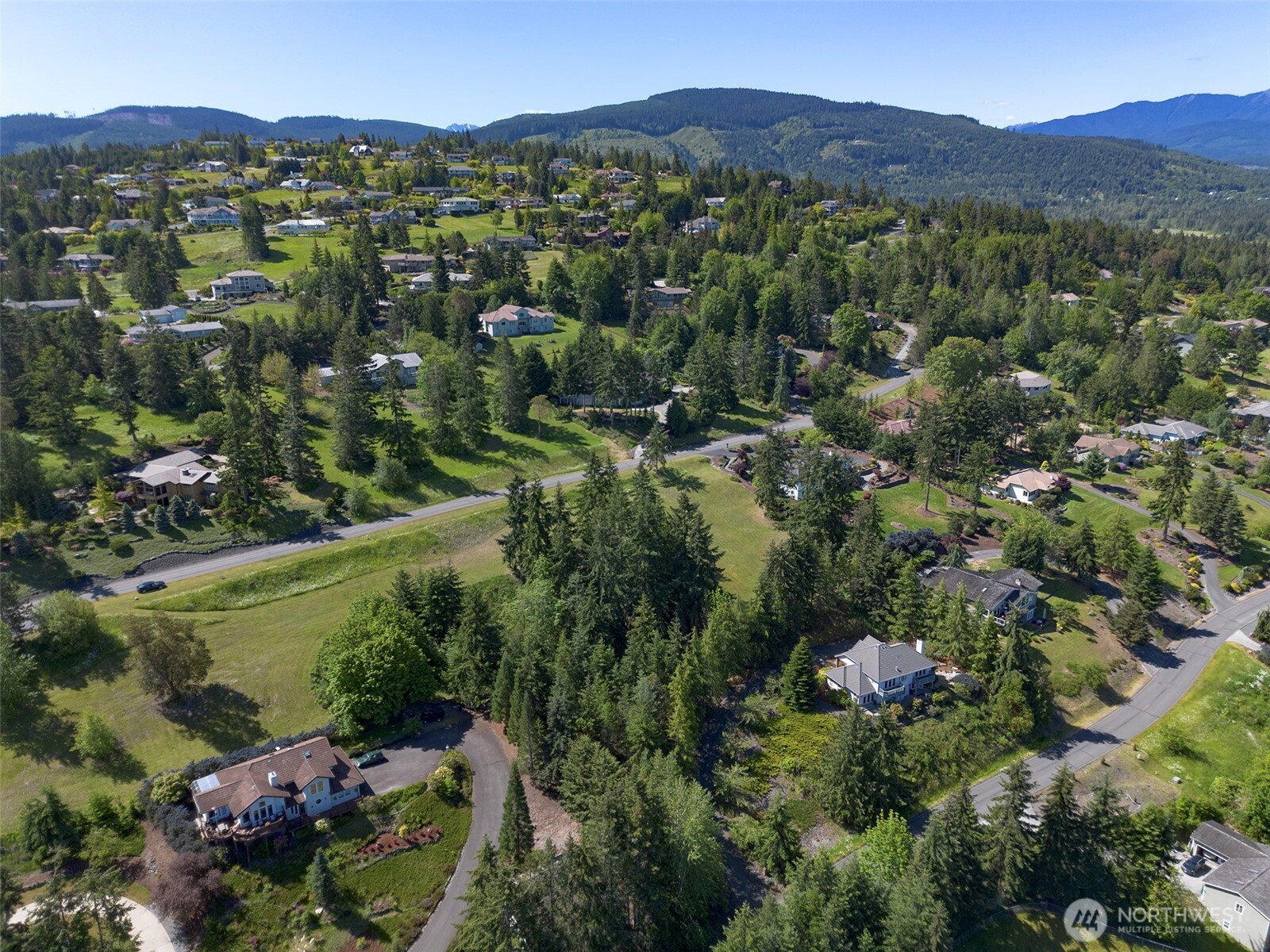 -nka Owls Nest Road Sequim, WA 98382 - Photo 33 of 38 an aerial view of a town with couple of houses