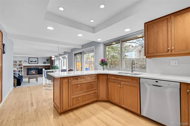 a dining room with furniture a large window and chairs