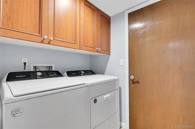 a view of entryway with cabinets and entryway