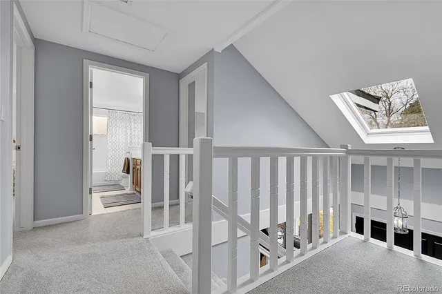 a spacious bedroom with a bed and a window