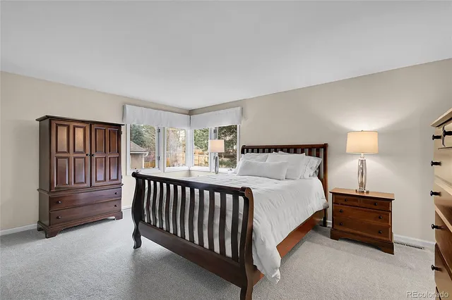 a bathroom with double vanity sink and mirror