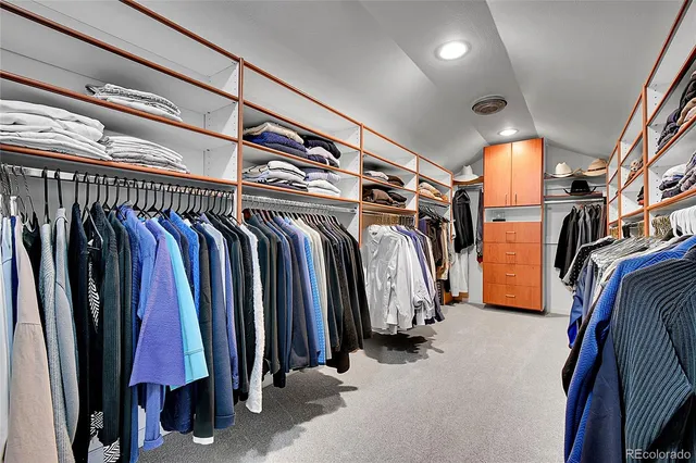 a bedroom with a bed and a lamp