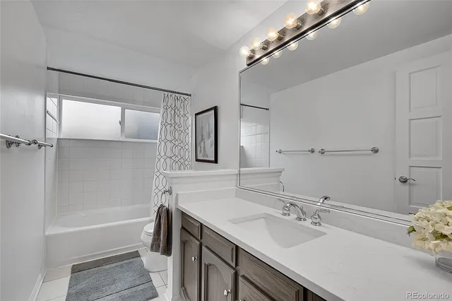 a bedroom with a bed and dresser