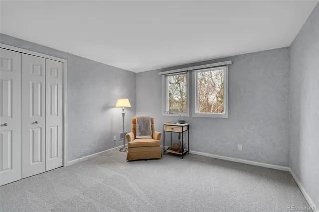 a room with stairs and a wooden floor