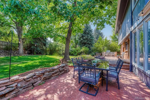 a view of a backyard with sitting area