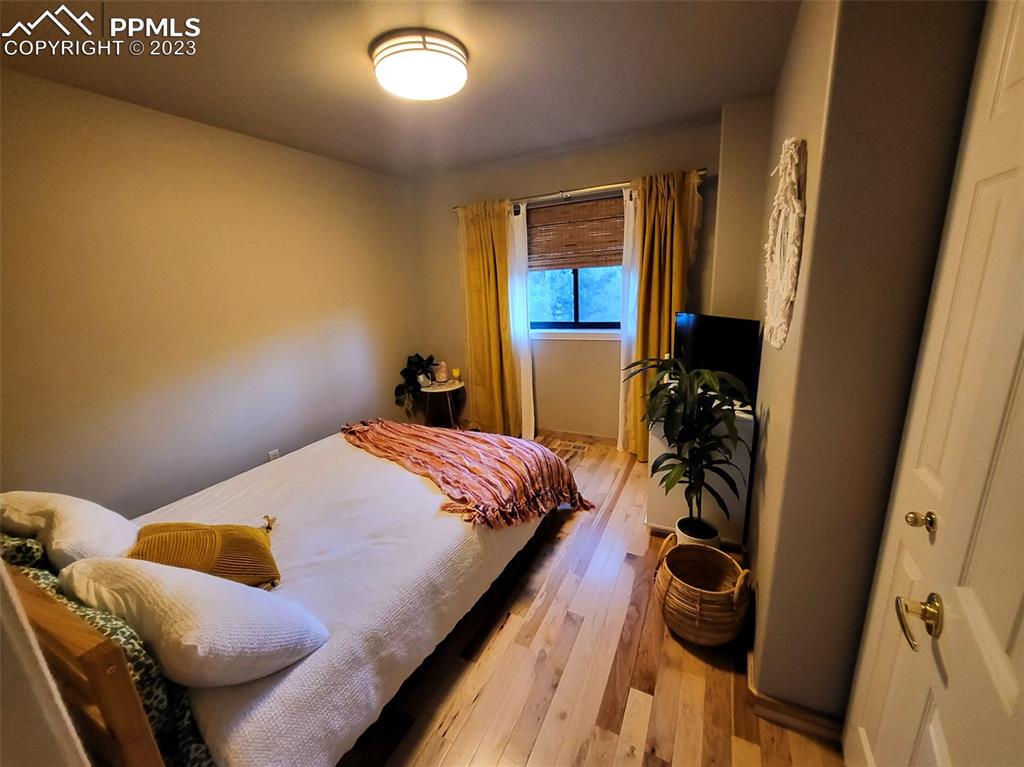 4440 Prairie Street Cascade, CO 80809 - Photo 15 of 31 a bedroom with a bed and a window
