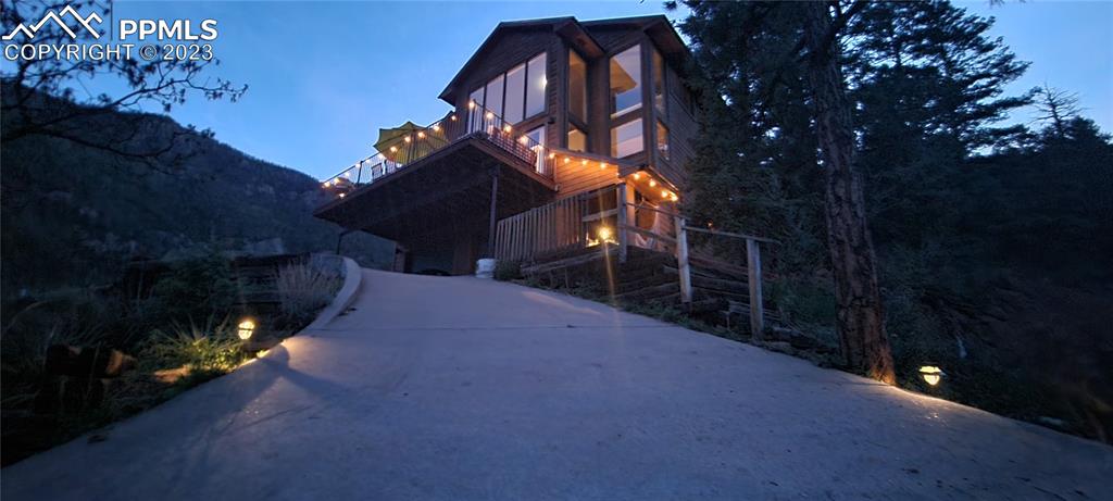 4440 Prairie Street Cascade, CO 80809 - Photo 2 of 31 a view of a house with a yard