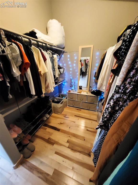 4440 Prairie Street Cascade, CO 80809 - Photo 23 of 31 a view of walk in closet with clothes and shoes