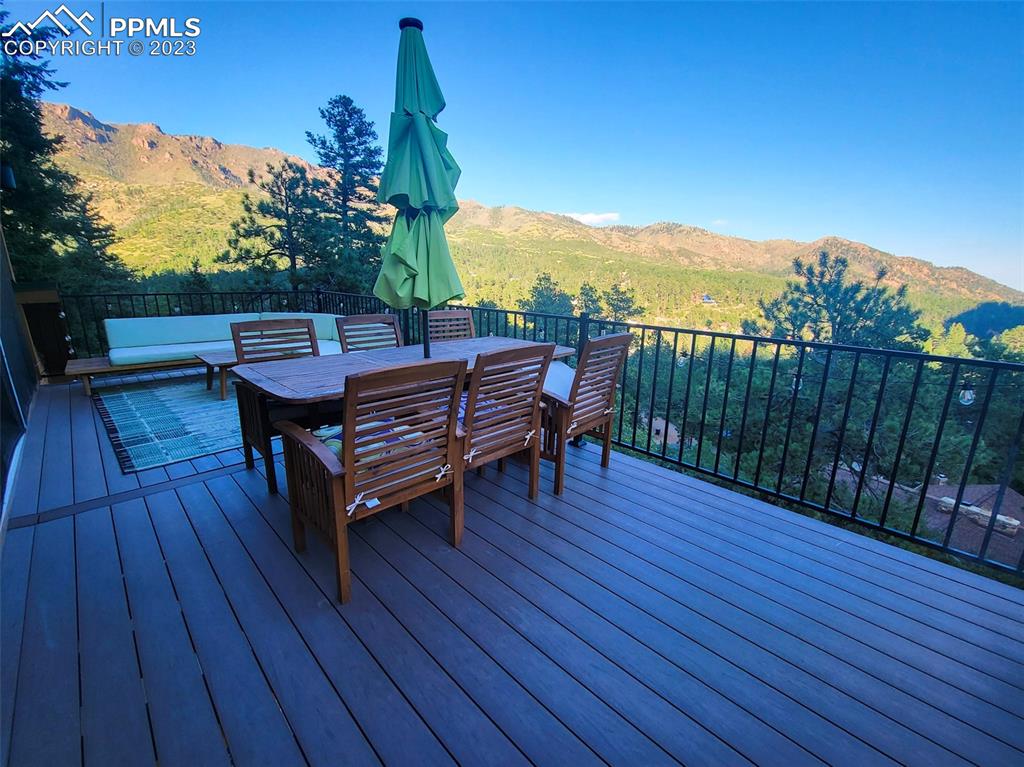 4440 Prairie Street Cascade, CO 80809 - Photo 27 of 31 a view of a wooden deck with furniture