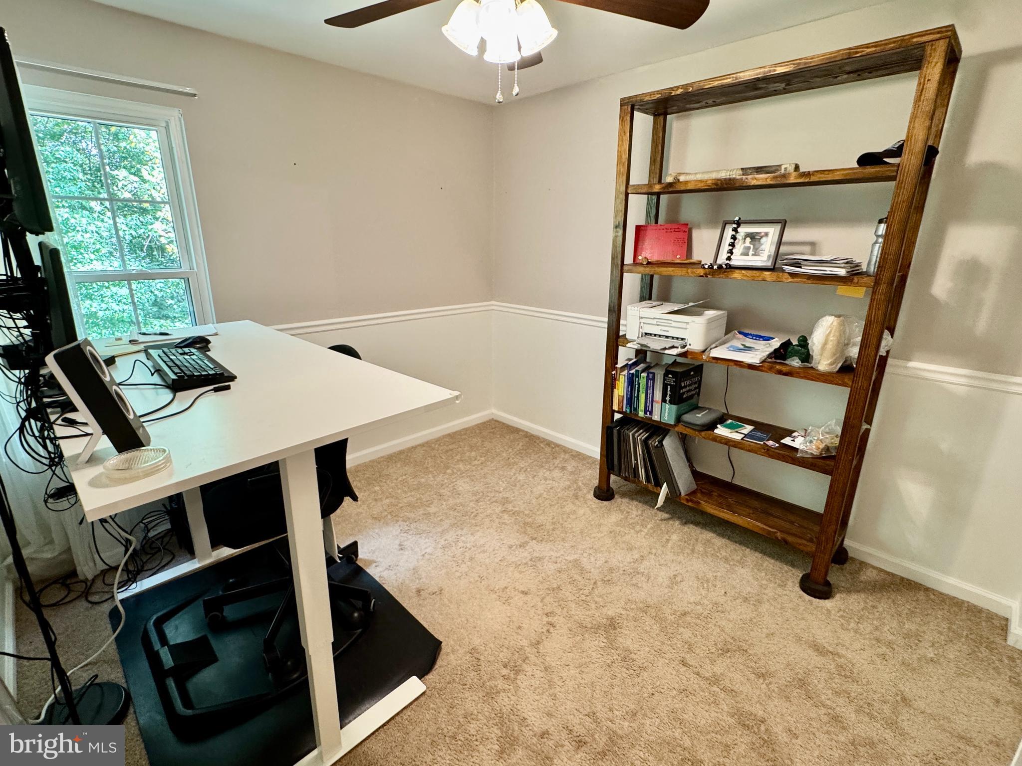 903 Wind Ridge Drive Stafford, VA 22554 - Photo 21 of 34 a view of a workspace with furniture and a window