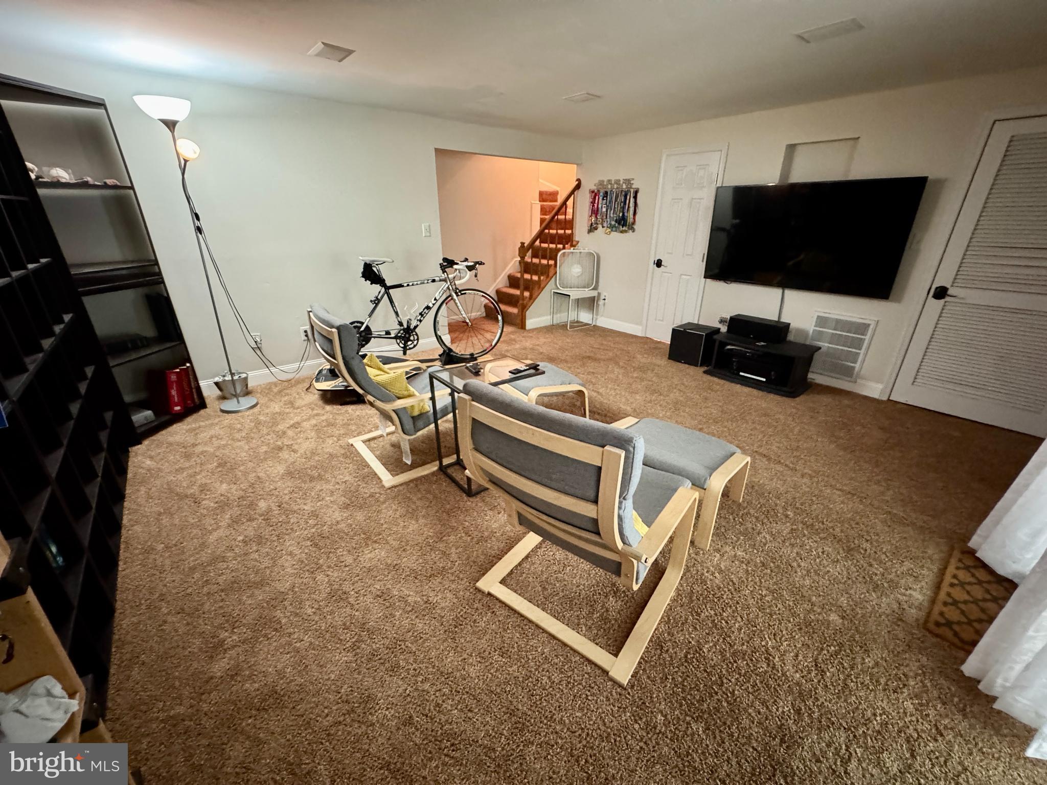 903 Wind Ridge Drive Stafford, VA 22554 - Photo 26 of 34 a room with gym equipment and a flat screen tv