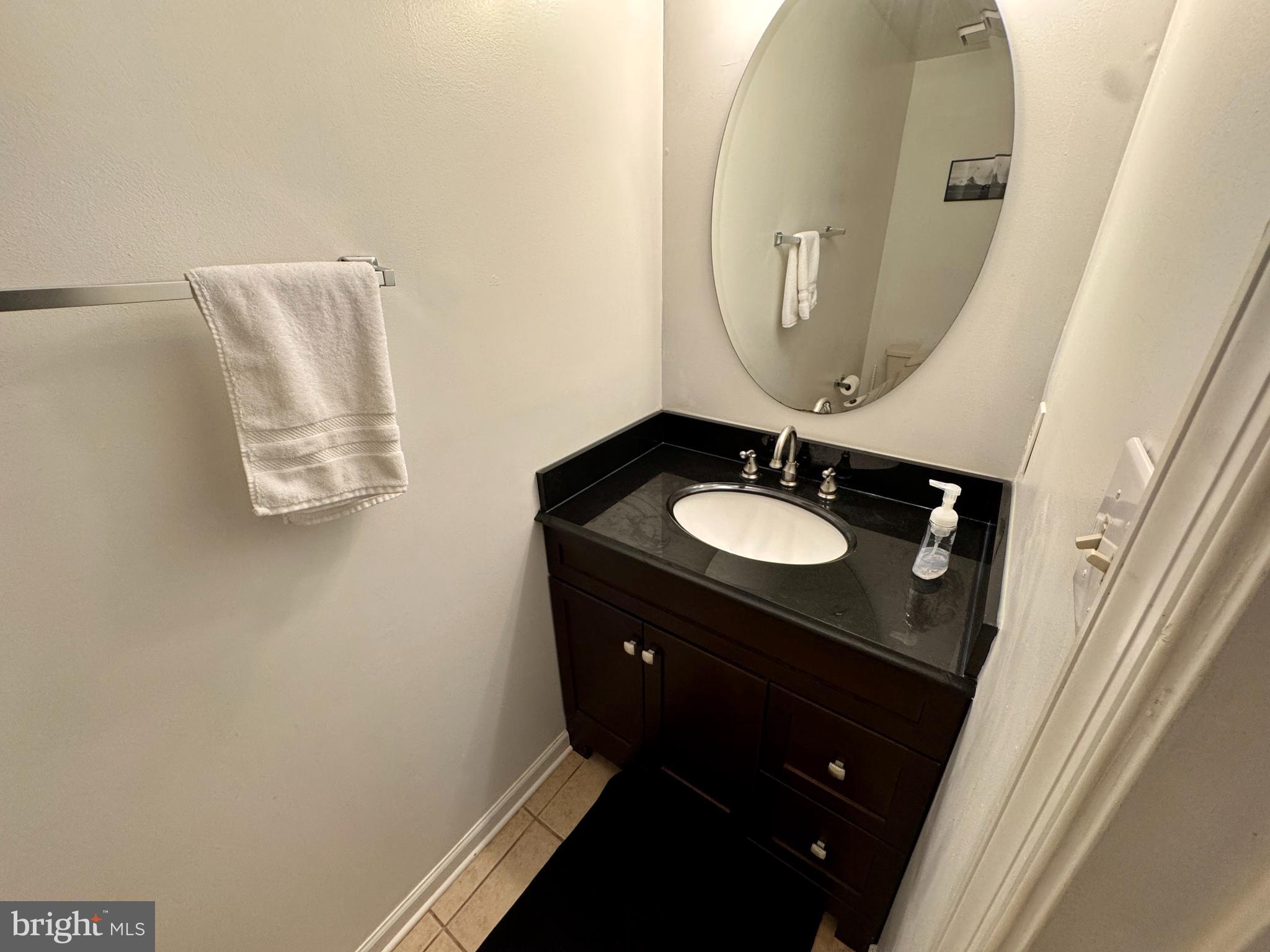 903 Wind Ridge Drive Stafford, VA 22554 - Photo 27 of 34 a bathroom with a sink and a mirror