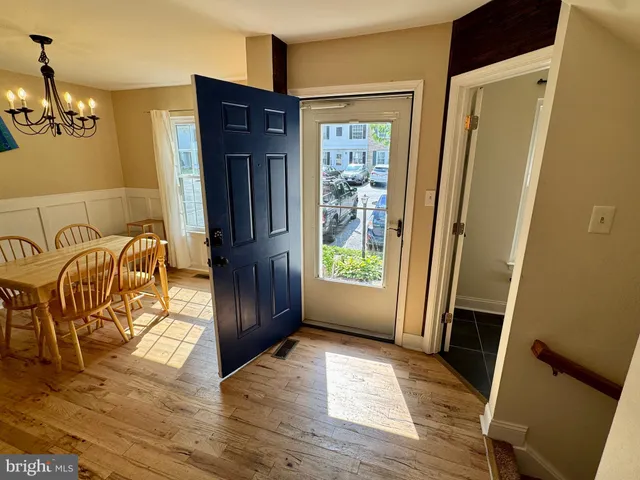 a view of a livingroom with furniture window and wooden floor