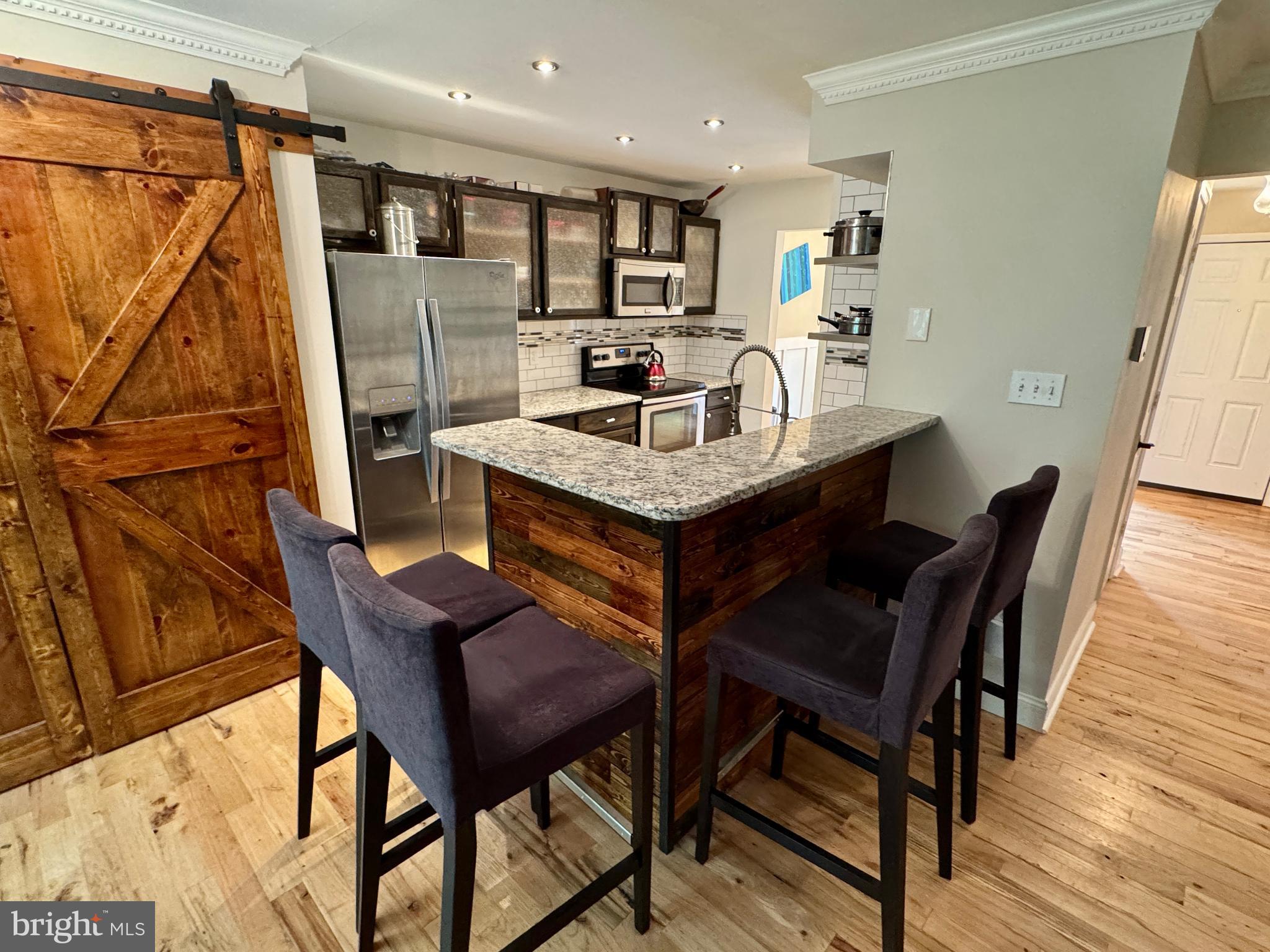 903 Wind Ridge Drive Stafford, VA 22554 - Photo 7 of 34 a view of a dining room with furniture and wooden floor