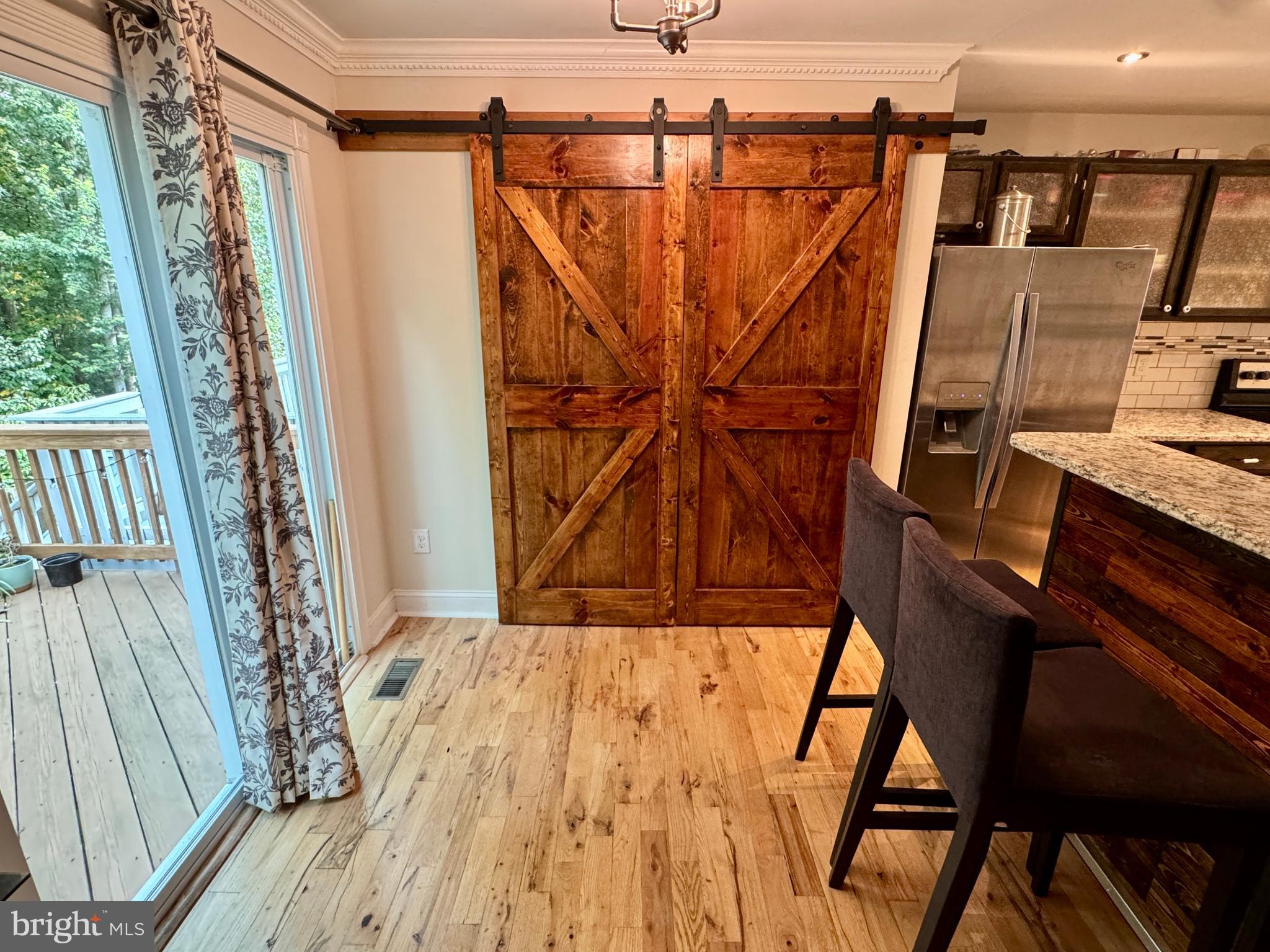 903 Wind Ridge Drive Stafford, VA 22554 - Photo 10 of 34 a view of a balcony with wooden floor and iron stairs