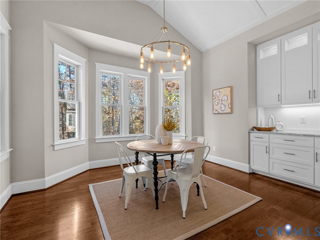 16125 Binley Road Midlothian, VA 23112 - Photo 21 of 50 a view of a dining room with furniture window and wooden floor